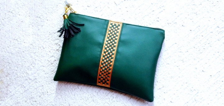 Green leather clutch bag at Qmuro